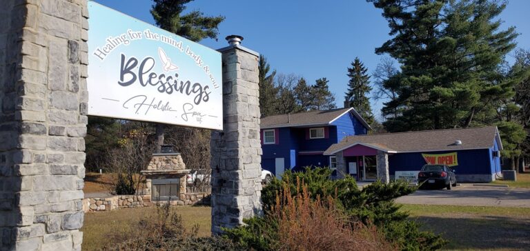 Sign board with Blessings Holistic Spa in front of their building