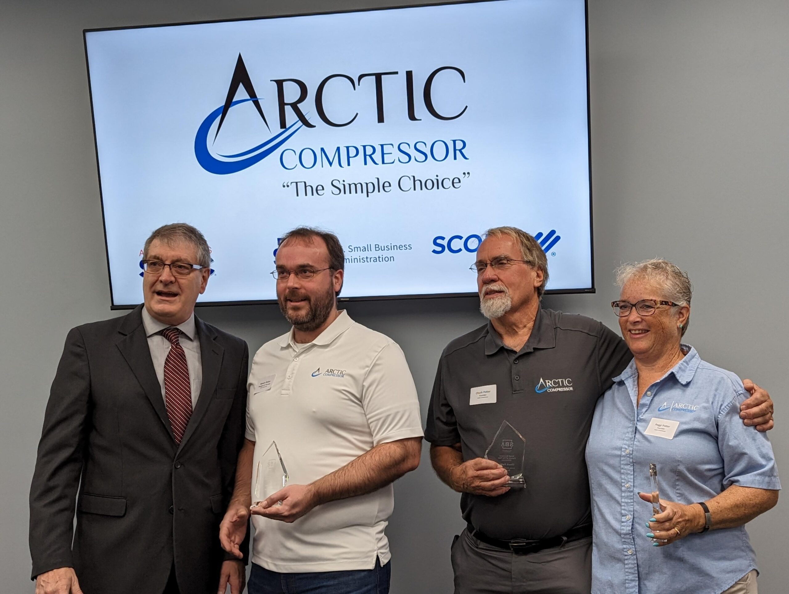 Eric presenting award to the Potters
