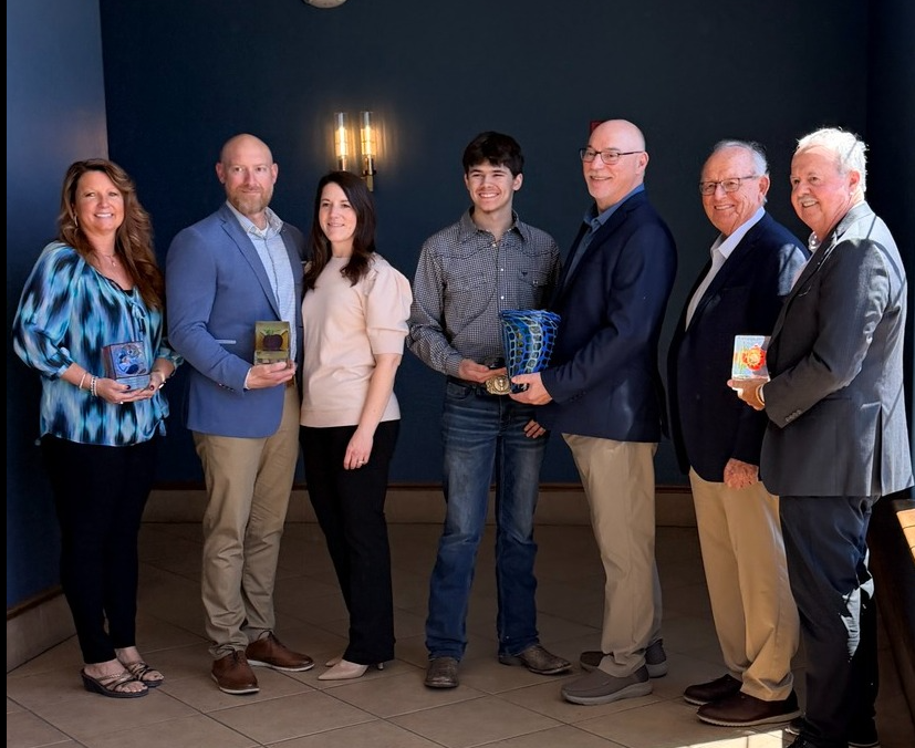 Hi Tec staff poses at award ceremony