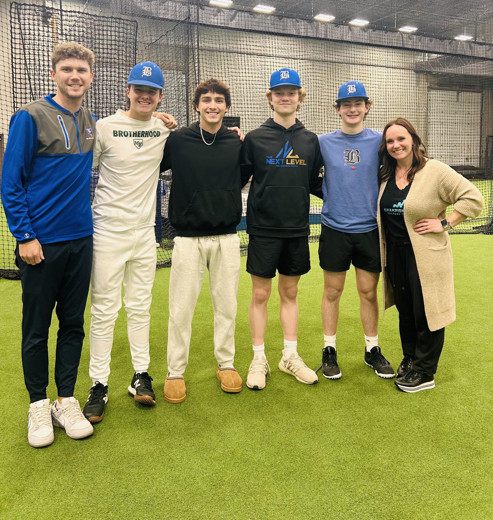 team posing on indoor soccer field
