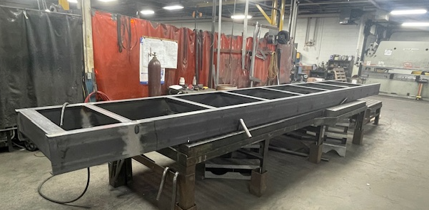 metal on conveyor belt in workshop