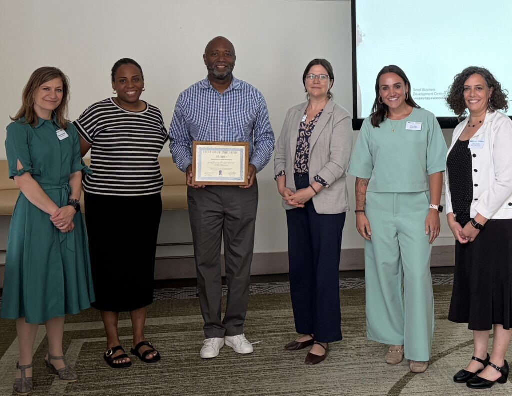 UWM team with director and associate director