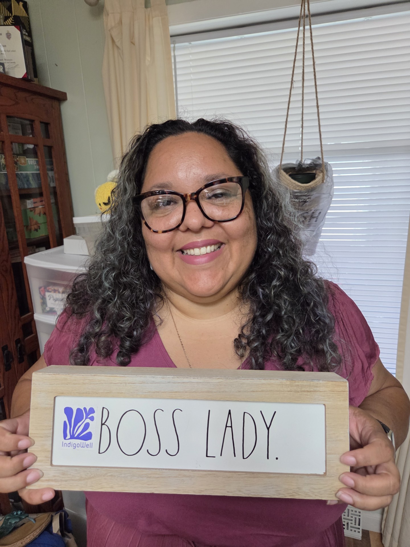 Myleerah Zarazua holding sign reading "Boss Lady